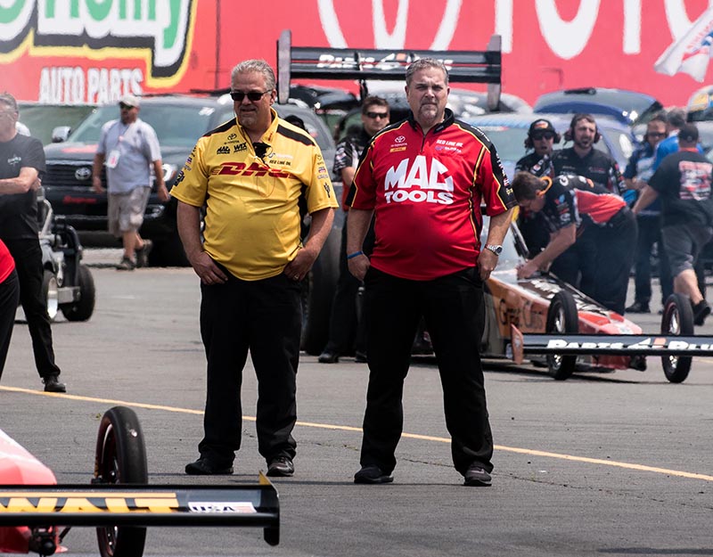 Brothers and fellow Crew Chiefs Jon (L) and Jim( R) Oberhofer survey the track conditions during qualifying at the Toyota NHRA Sonoma Nationals