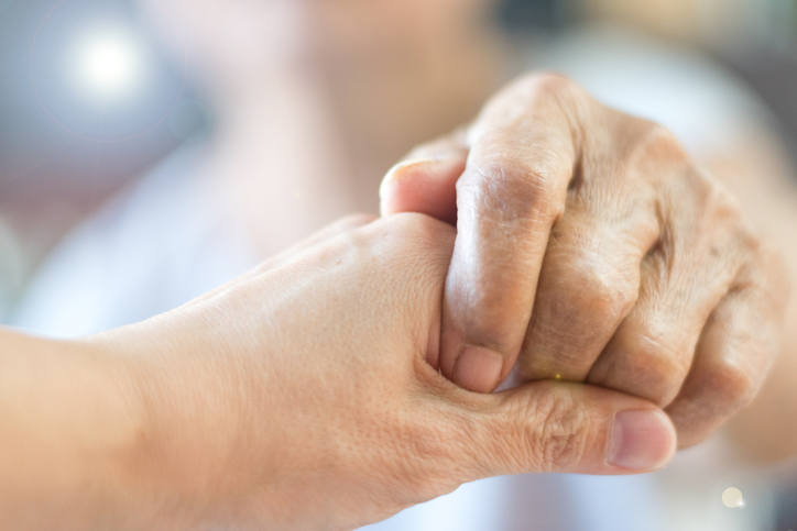 Caregiver, Specialized Assistance, Carer Hand Holding Elder Hand Woman In Hospice Care. Philanthropy Kindness To Disabled Concept.public Service Recognition Week